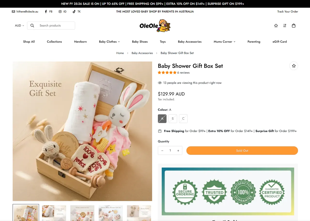 An OleOle product page: a baby shower gift box set with variants, add-to-cart and trust badges